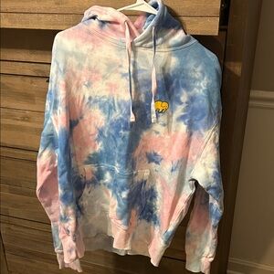 Ivory Ella Peanuts Tie-Dye Hoodie with Snoopy on the back.